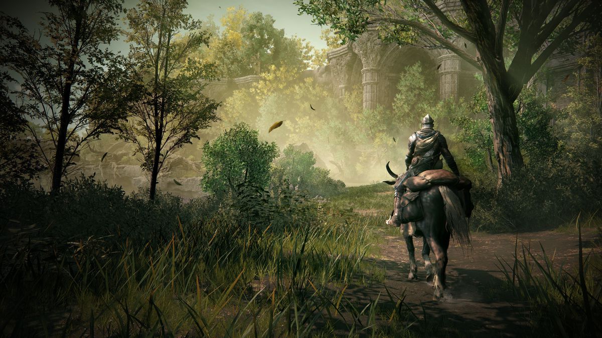 A Tarnished rides on the back of Torrent through a wooded area in front of a stone building in a screenshot from Elden Ring: Shadow of the Erdtree