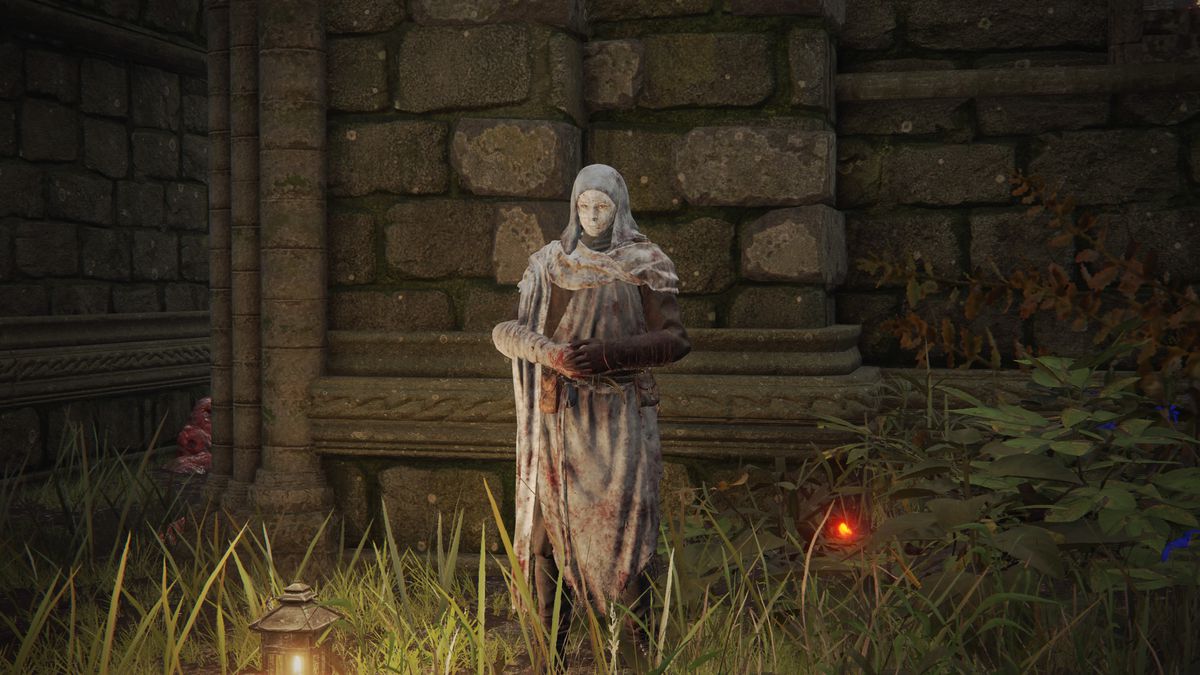 A screenshot of White Mask Varré waiting outside of Rose Church in Elden Ring