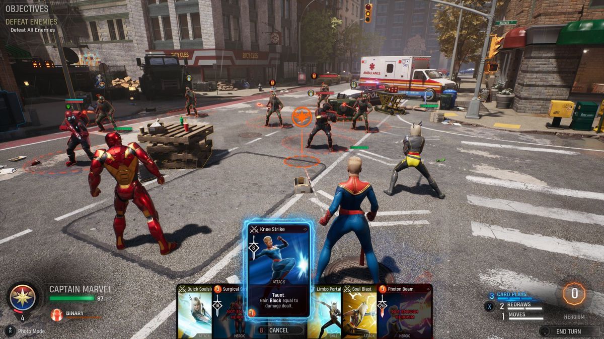 An in-game screenshot of Marvel’s midnight suns, showing four heroes on the game’s battlefield — a downtown New York intersection with damaged vehicles and debris blocking the road