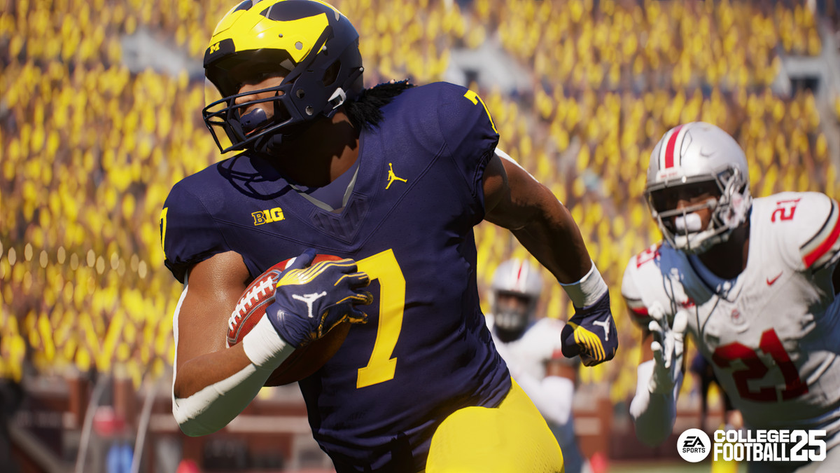 Donovan Edwards from Michigan University running the ball while being chased by an Ohio State defender in EA Sports College Football 25