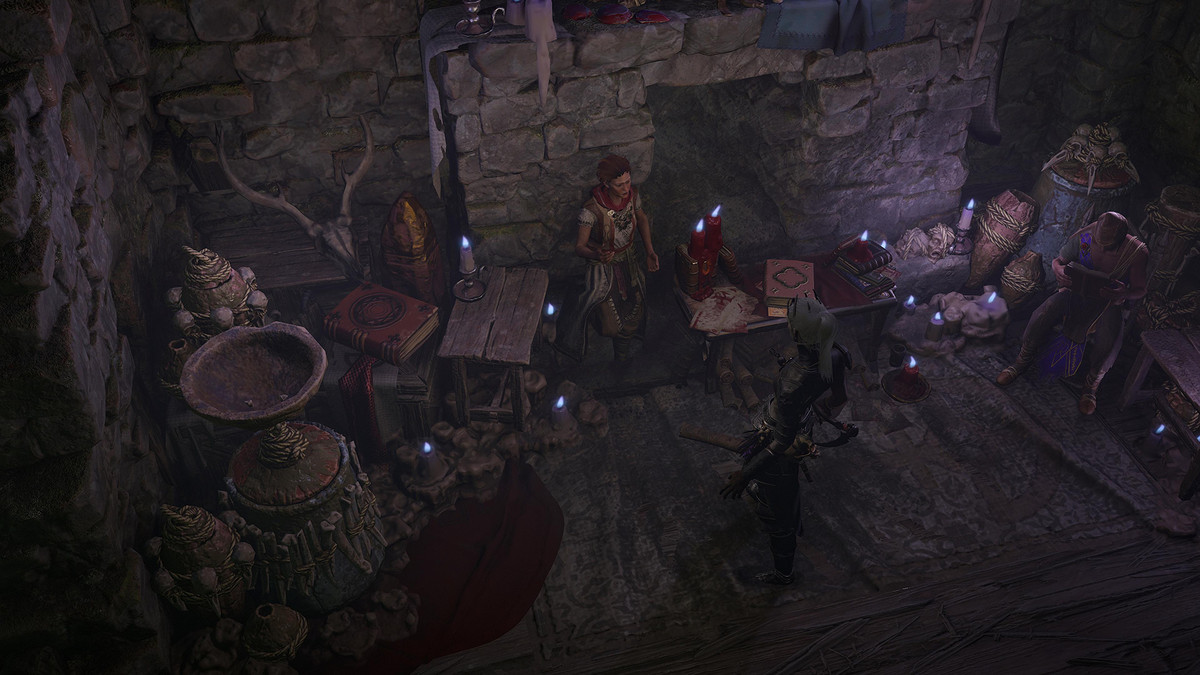 A group of quest givers stand by a table in Diablo 4