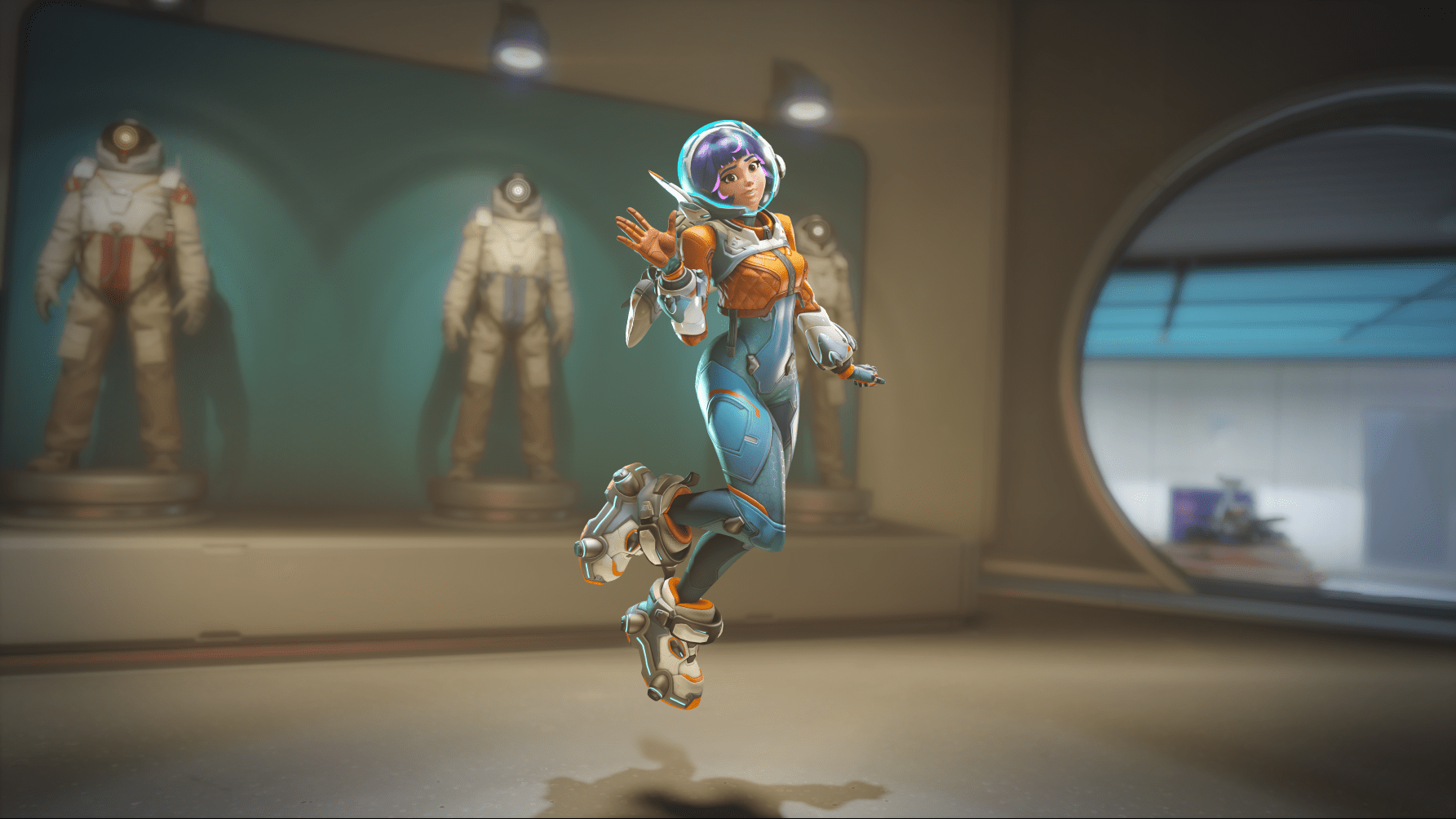 A screenshot of Juno (aka Space Ranger) hovering in the air and waving at the camera in Overwatch 2