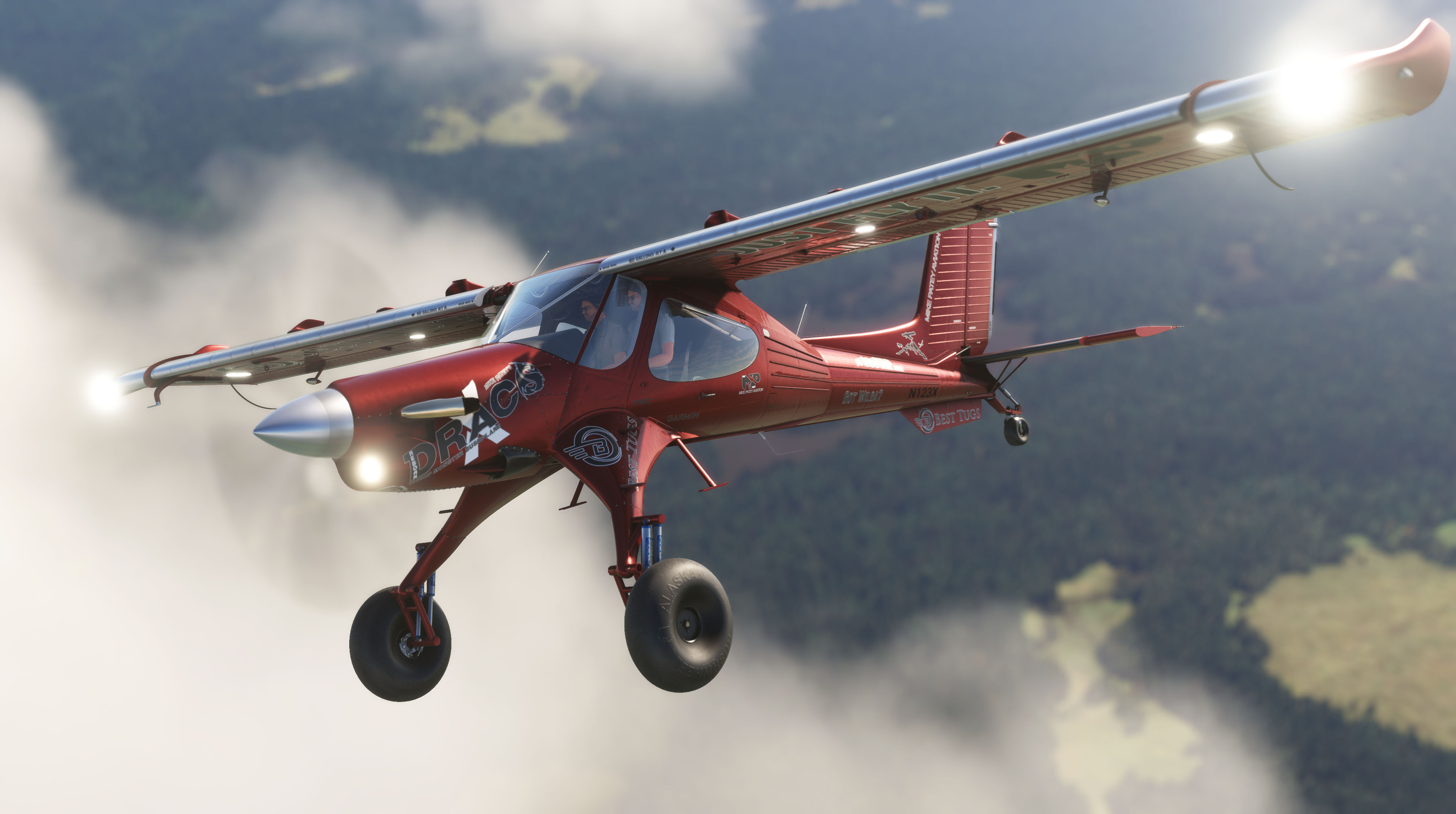 A red plane with a silver leading edge on its main wing flies through the air.