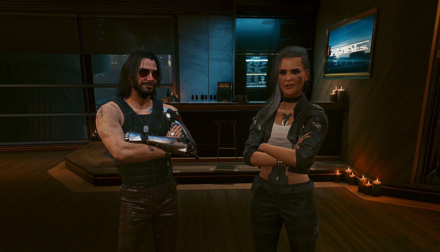 A Cyberpunk 2077 screenshot shows Johnny and Rogue standing next to each other with their arms crossed