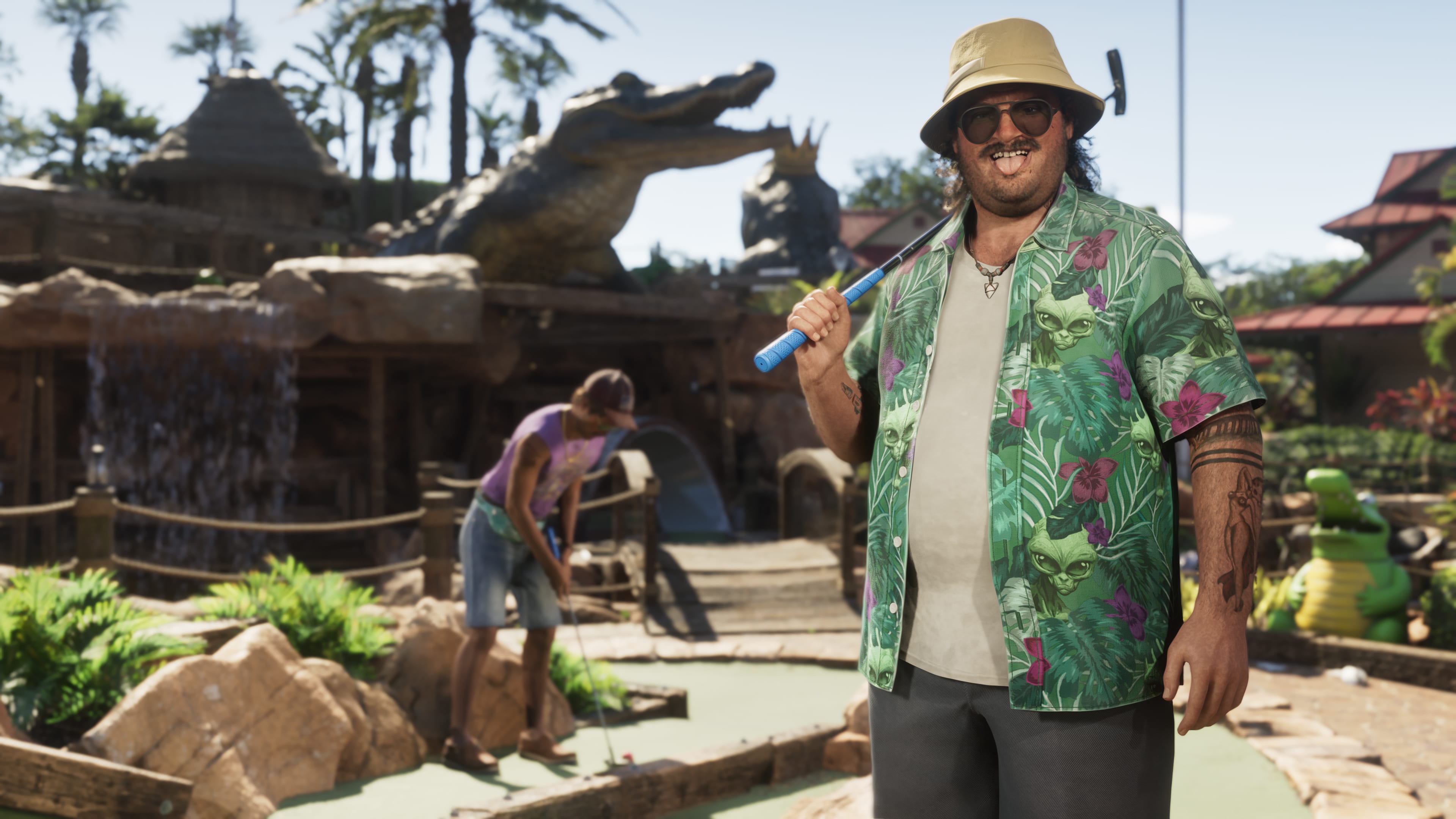 Cal Hampton holds a golf club at regular sized golf in GTA 6 (just kidding, this is a mini golf course)