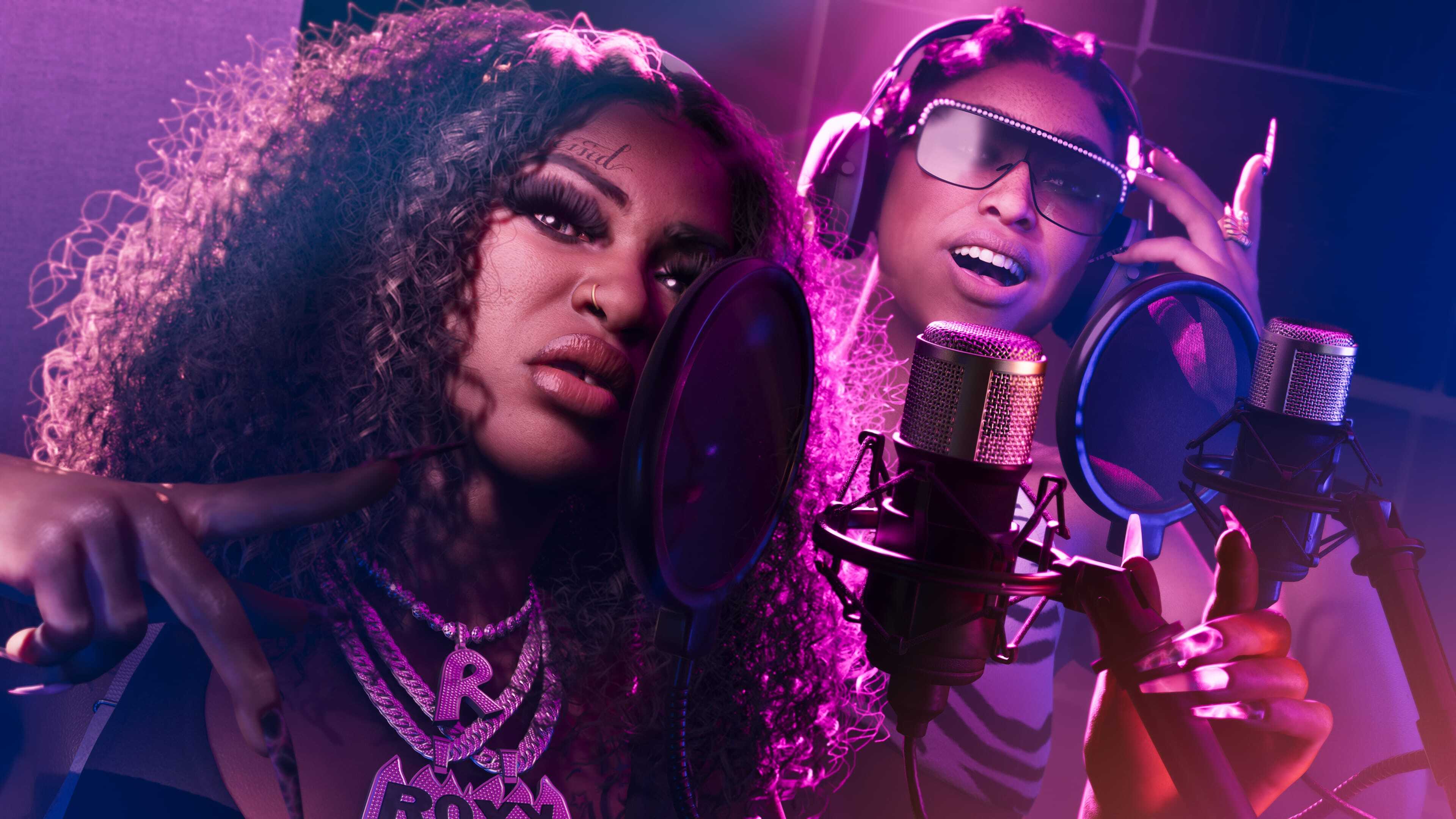 The two female members of Real Dimez, an R&B group in GTA 6, singing into two microphones in a recording studio together
