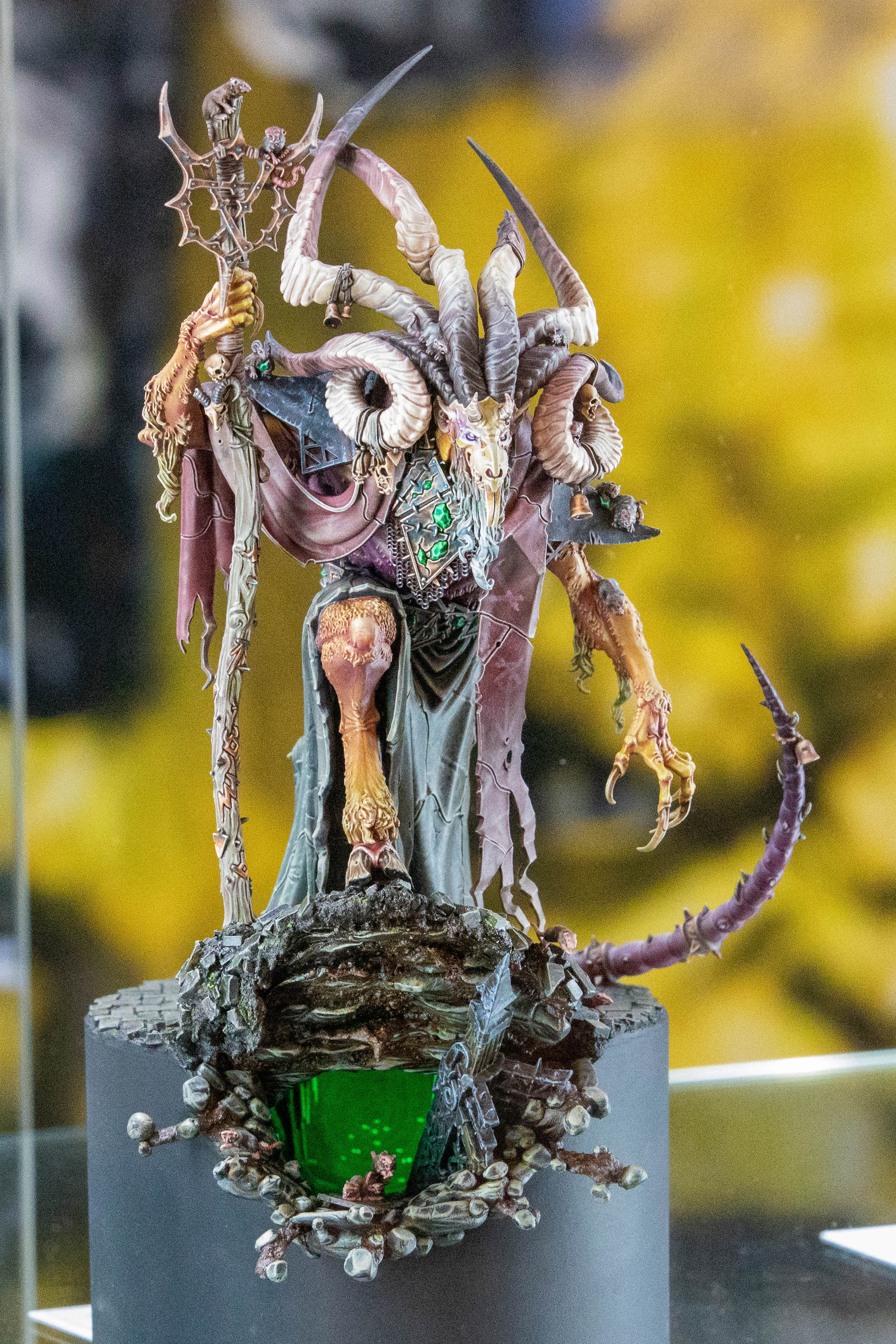 A painted miniature model of a goat-like sorcerer