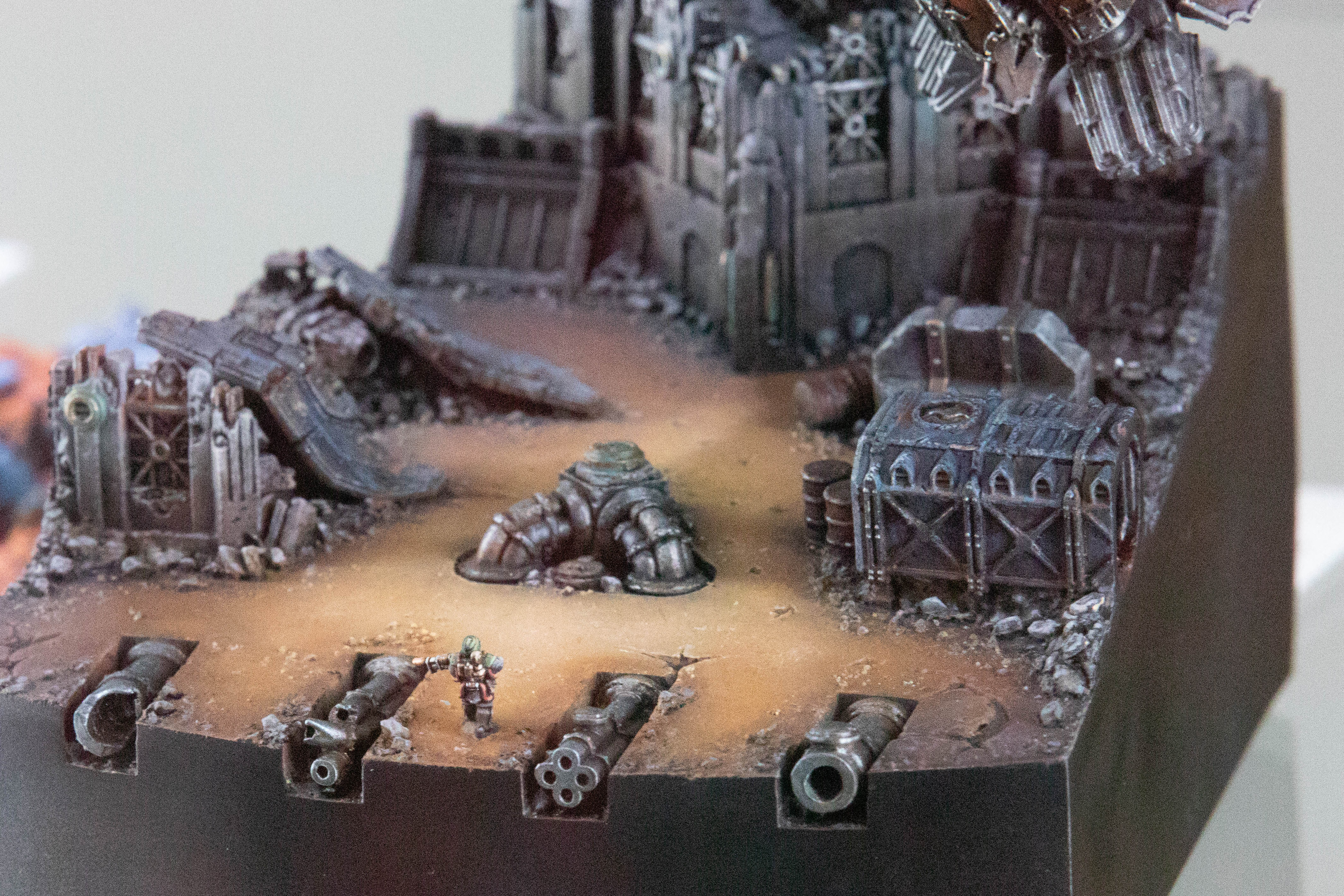 A close-up detail of a tiny human warrior in a Warhammer model