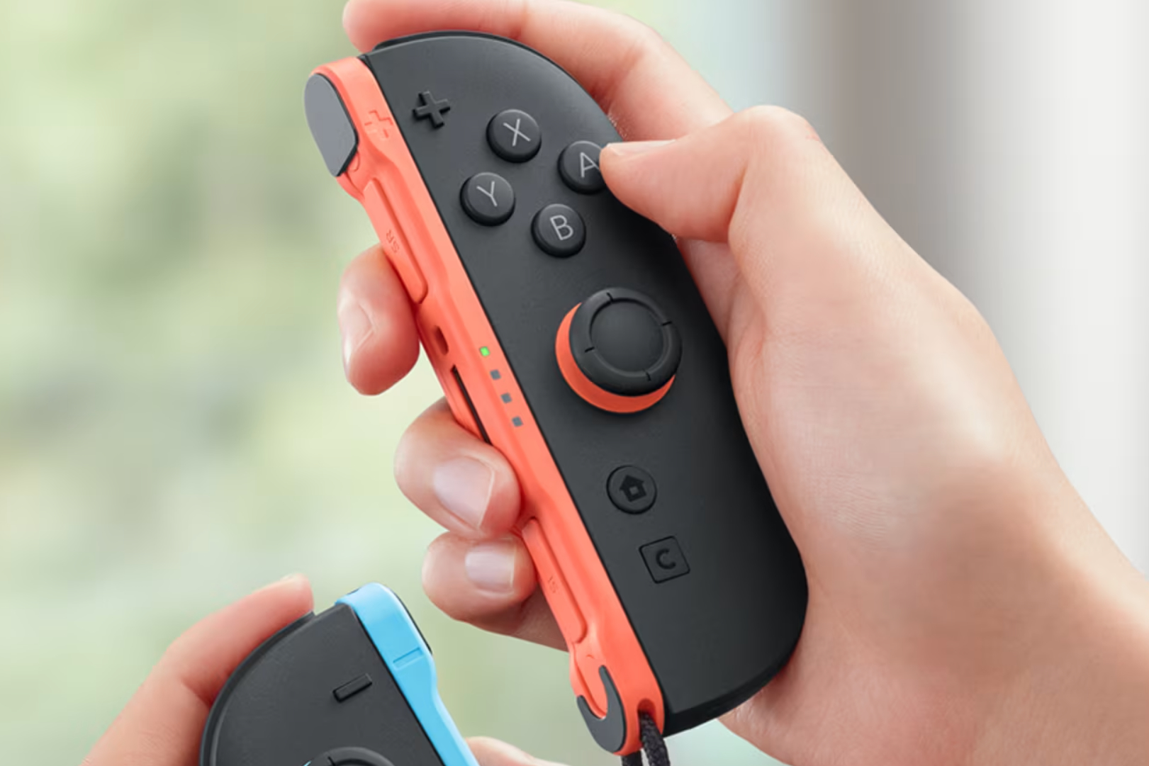 hands holding Nintendo Switch 2 Joy-Cons