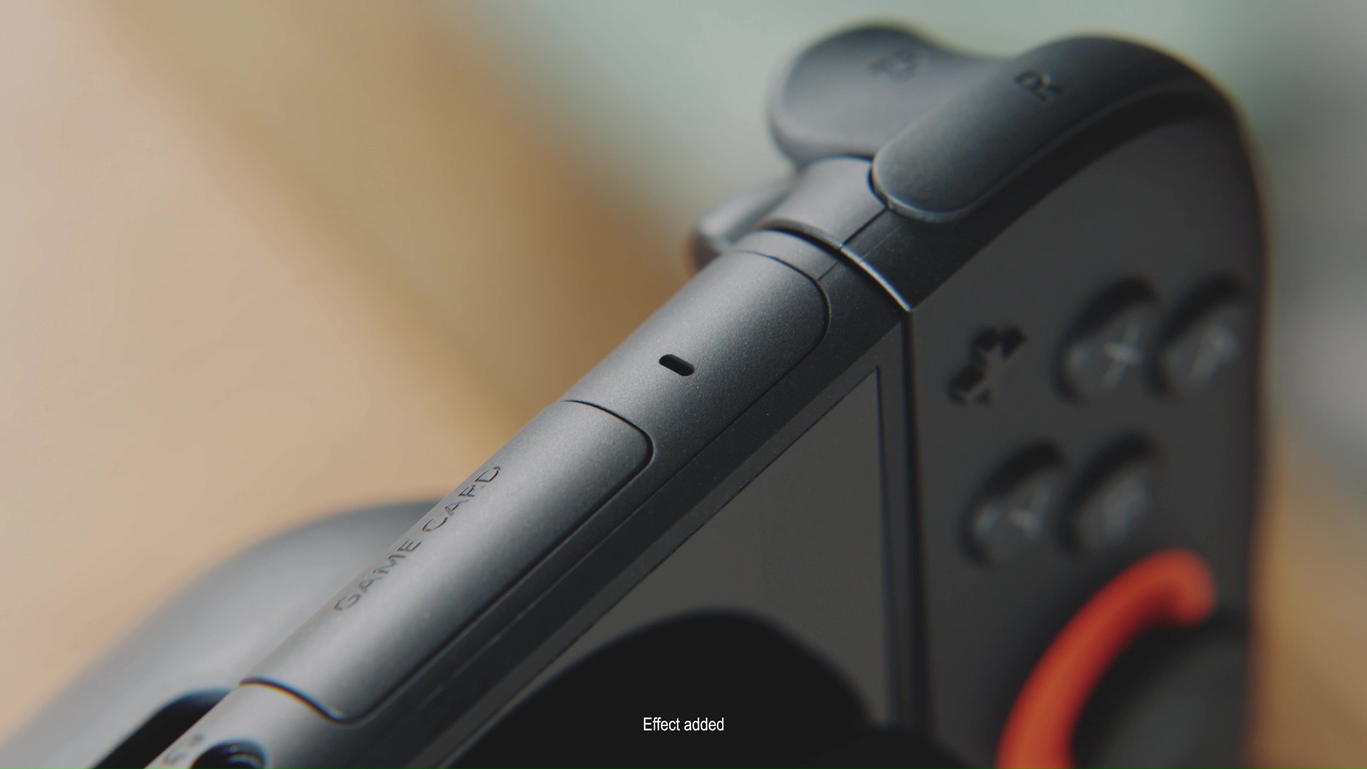 a close-up of the microphone built into the top of the Nintendo Switch 2, to the right of the Game Card slot