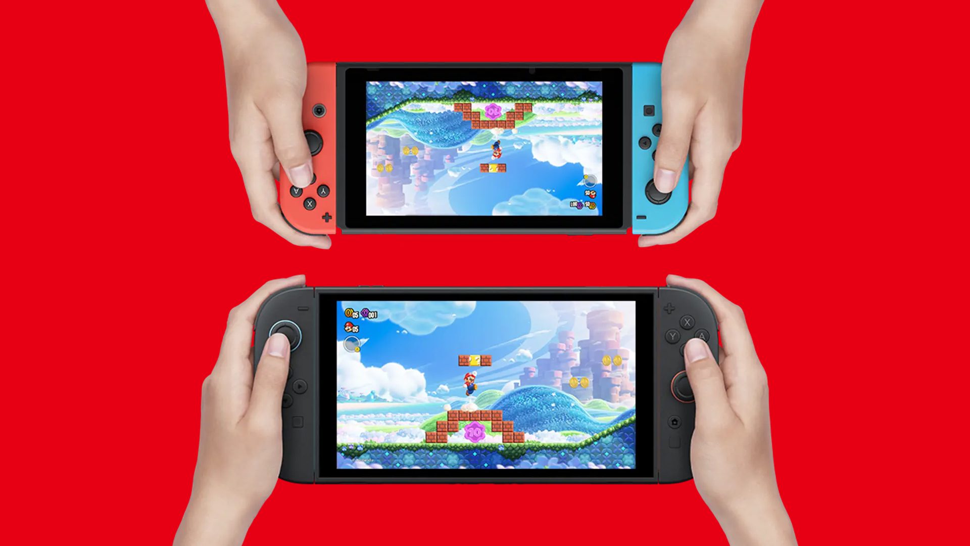 Two people’s hands hold one Nintendo Switch each. One holds a Switch and the other holds a Switch 2.