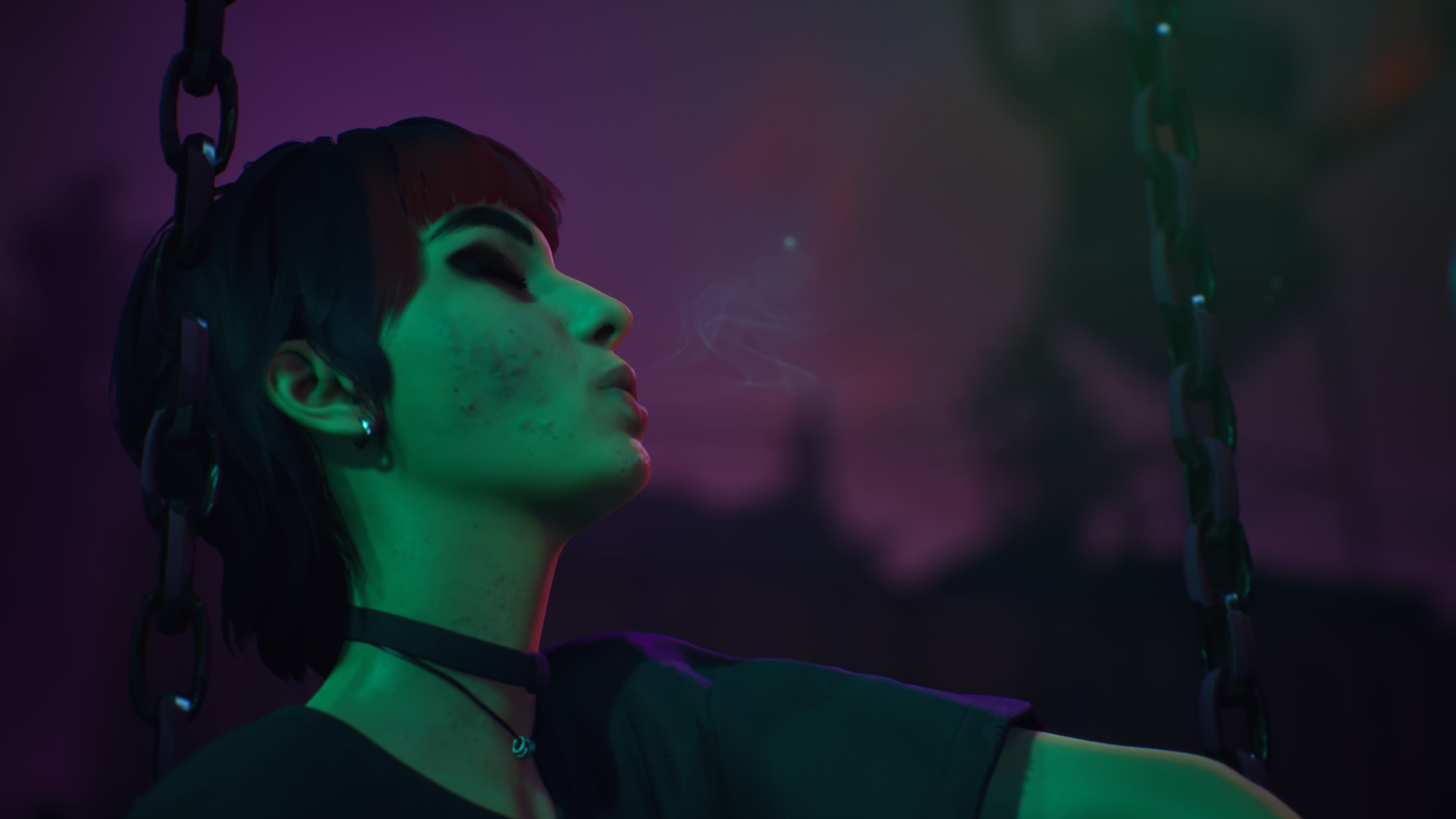 A goth girl on a swingset at night
