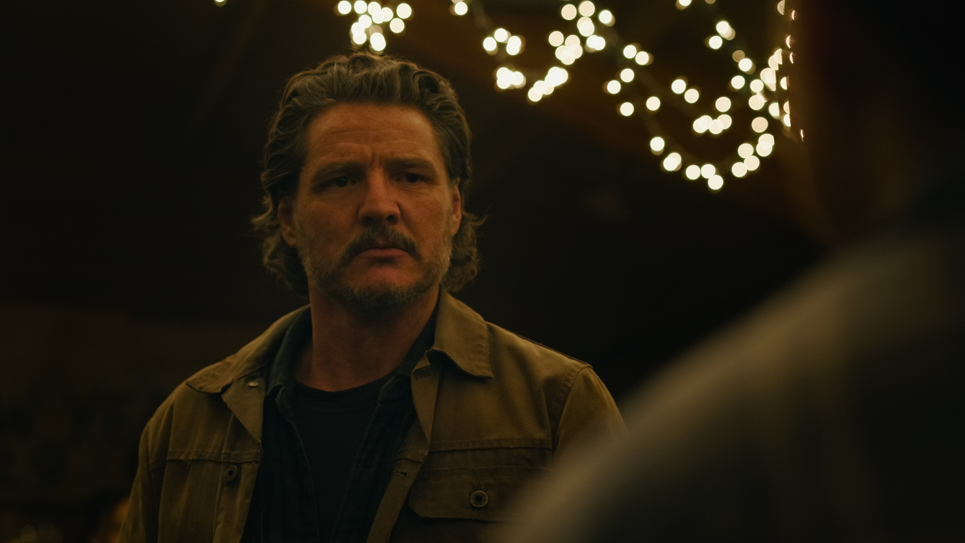 Joel looking at someone in a still from The Last of Us season 2