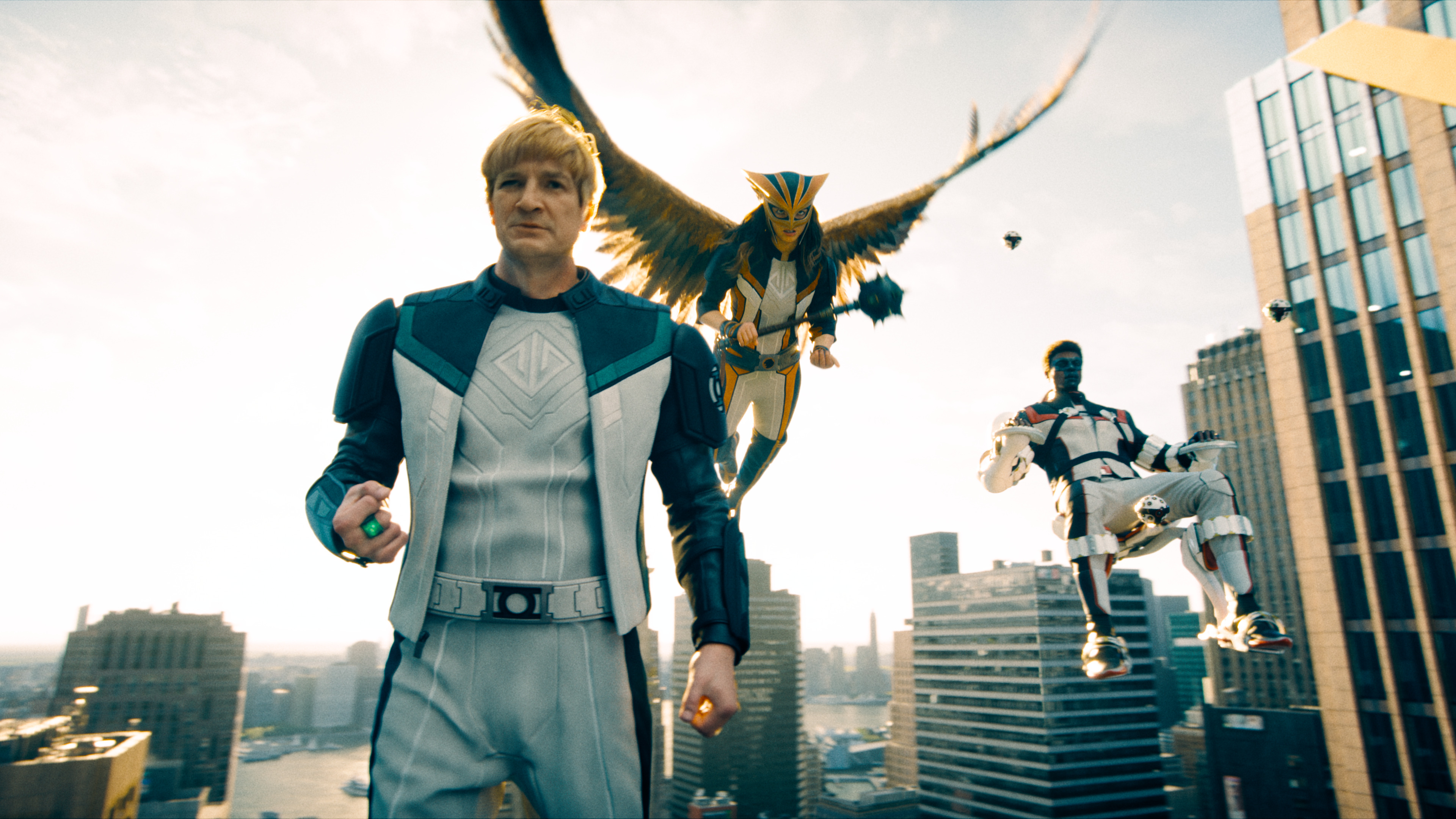 Guy Gardner (Nathan Fillion), Hawkgirl (Isabela Merced), and Mr. Terrific (Edi Gathegi) arrive on the scene in James Gunn’s Superman
