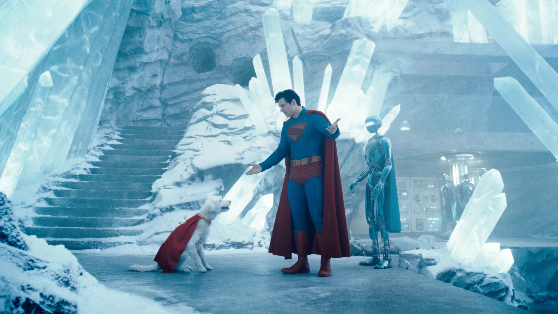 Superman stands with his robot Four and dog Krypto in the Fortress of Solitude in James Gunn’s Superman
