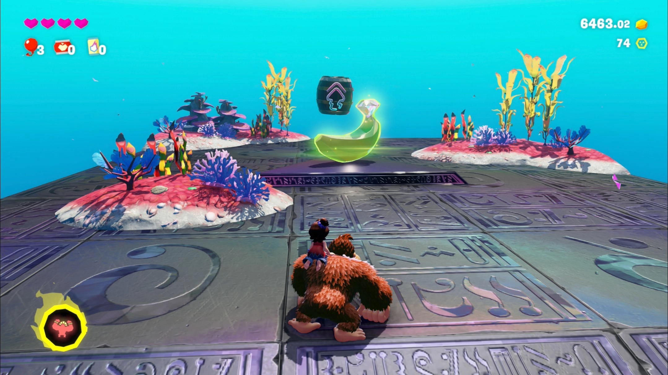 DK stands in front of a Banandium Gem on a silver platform underwater in the Lagoon Layer in Donkey Kong Bananza